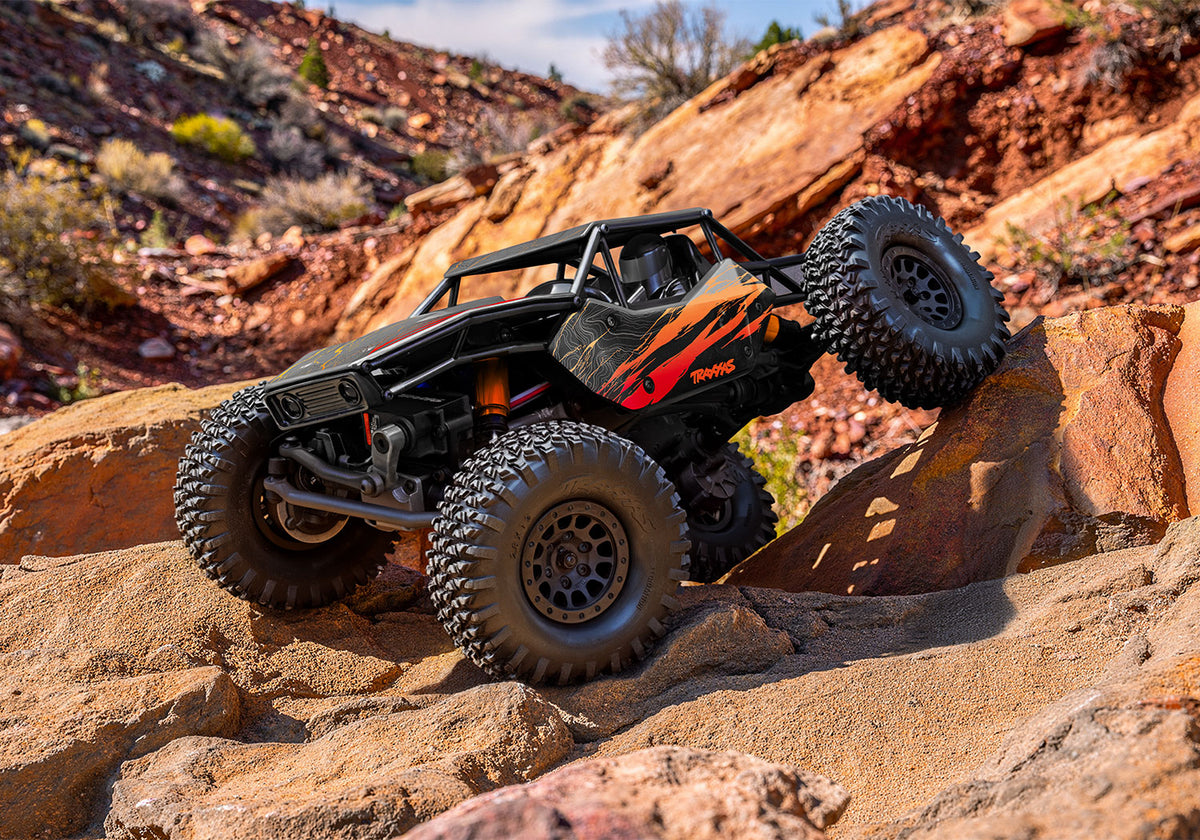 Orange TXC-4M crawling on rocks