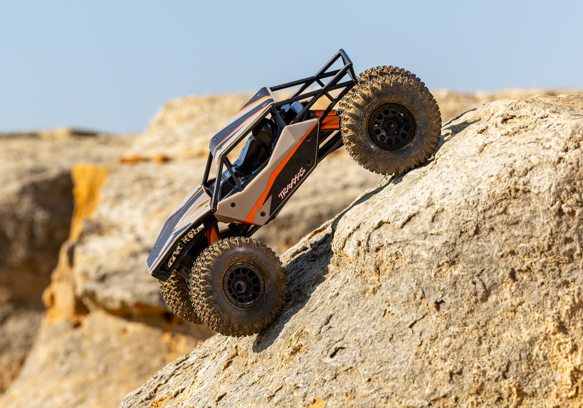 Tan TXC-4M crawling, side view