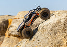 Tan TXC-4M crawling, side view