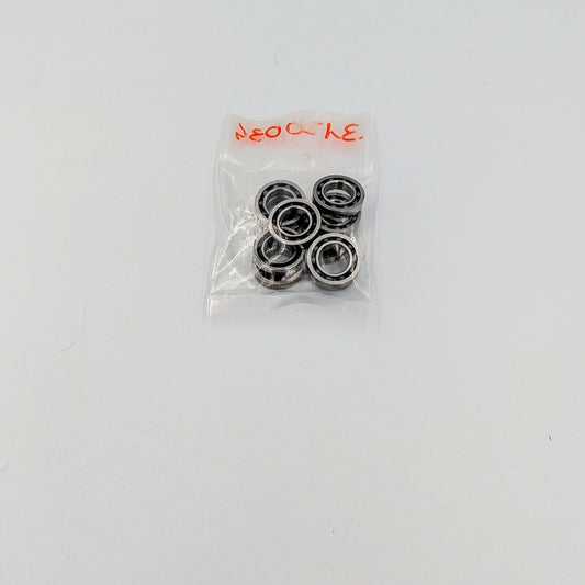 Pack of metal bearings in a clear plastic bag on a white background