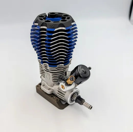 Angled view of the carburetor sitting low on the engine case