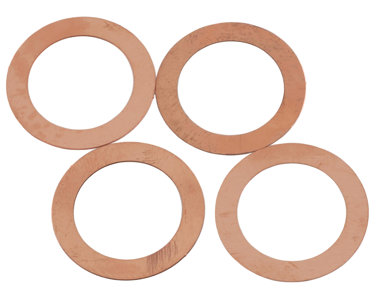 A set of copper head gasket shims of varying thicknesses.