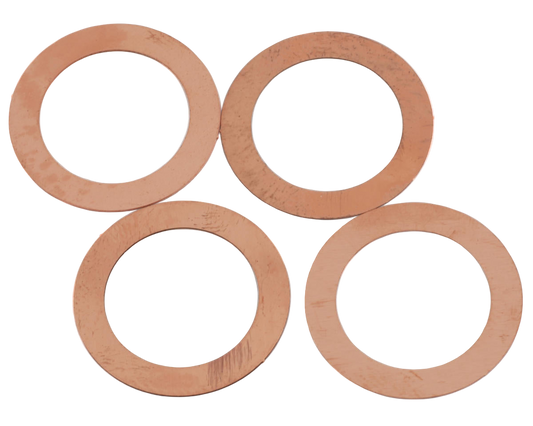 A set of copper head gasket shims of varying thicknesses.