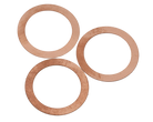 Three copper head gasket shims arranged in an overlapping fashion.