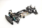 Black metal chassis of a remote control car on a white background