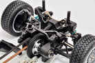 Close-up of a mechanical model with gears and wheels on a white background