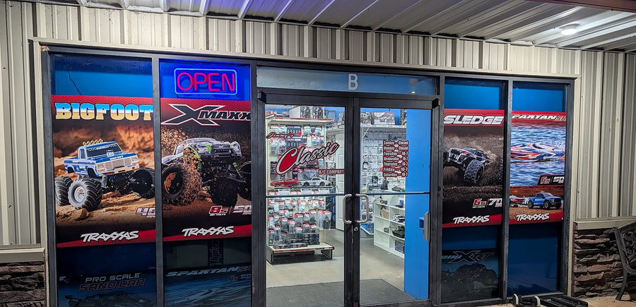 The Classic RC shop front at night with the OPEN sign lit